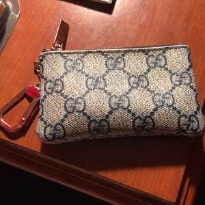 Gucci coin pouch very fashionable holds a lot.